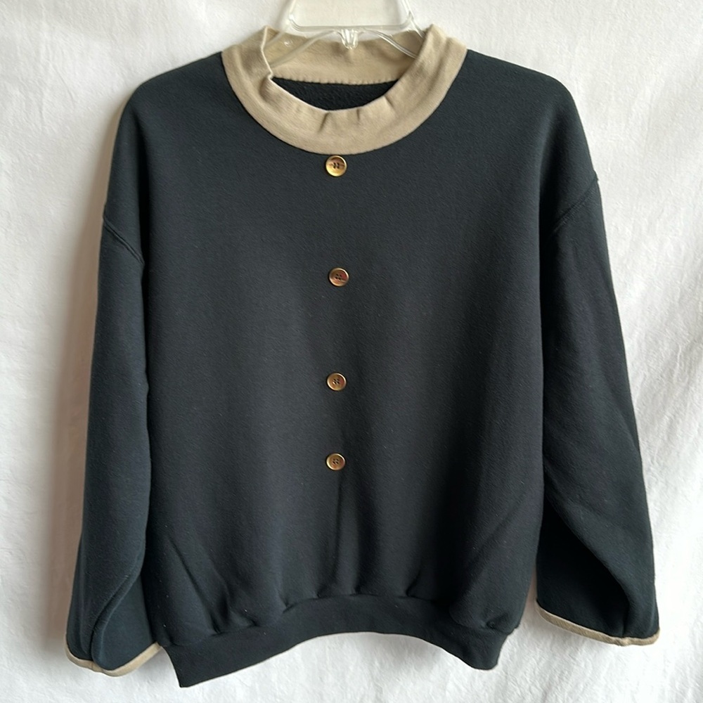 Customized black sweatshirt with added buttons, collar, and sleeve ends, size L